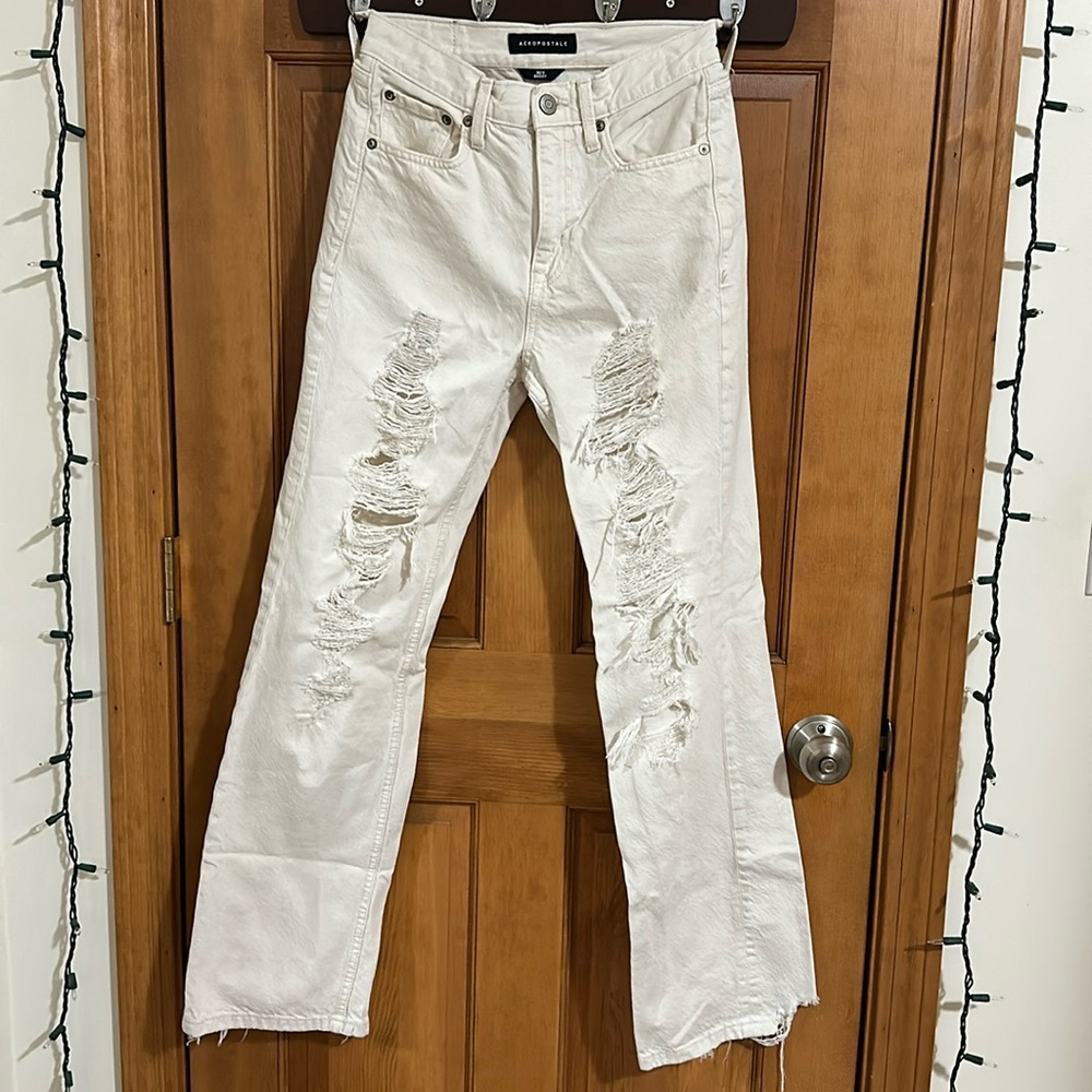 cream ripped baggy jeans
